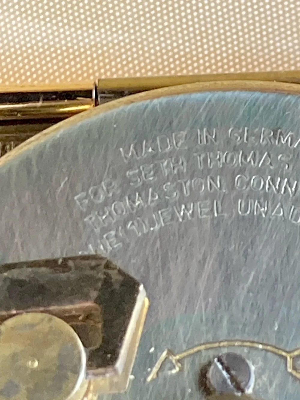 Classic mid-century Seth Thomas folding travel alarm clock in gold-tone texture